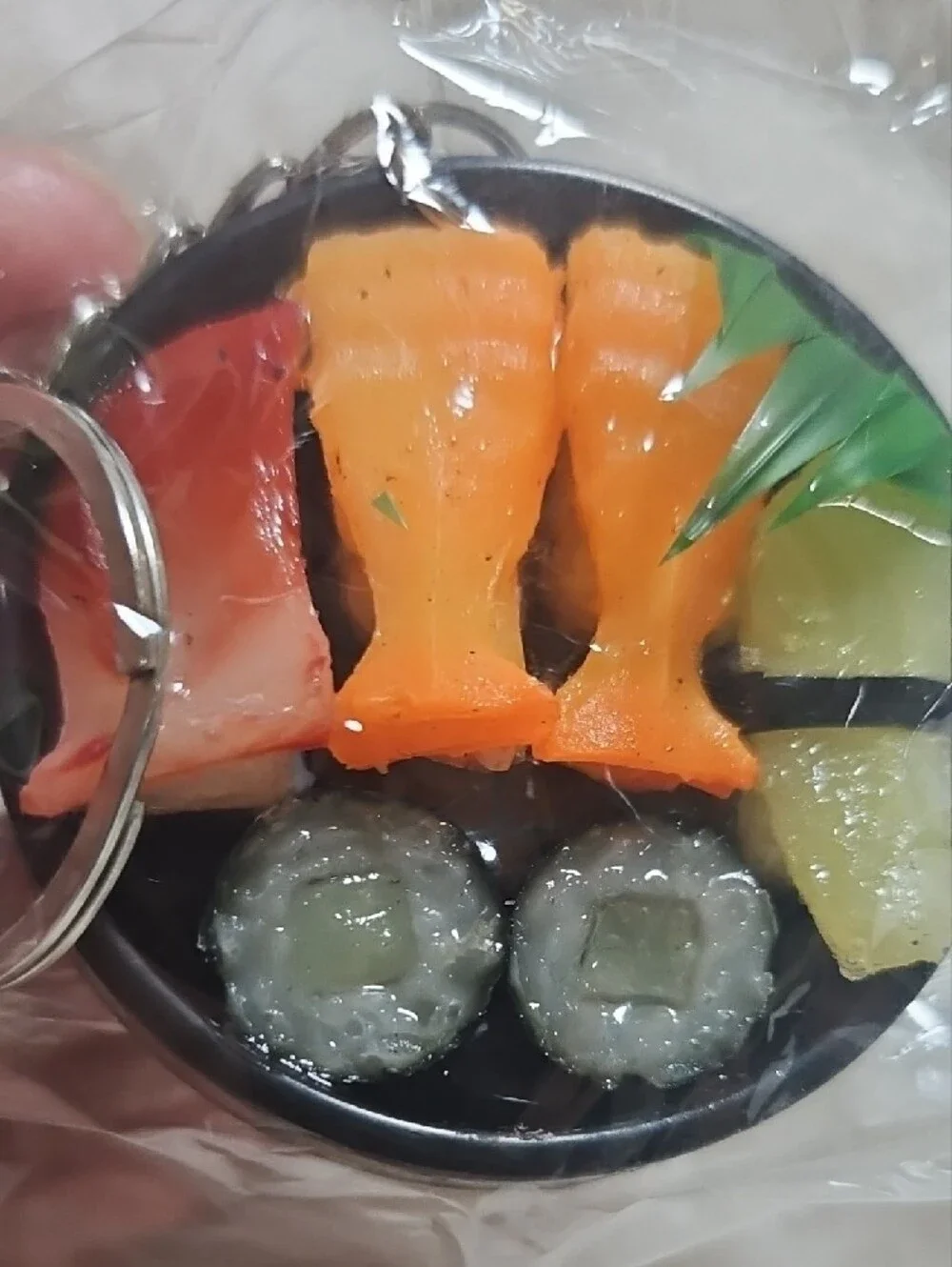 Source Unknown Black Sushi Keychain with Orange, Green and Pink Accents